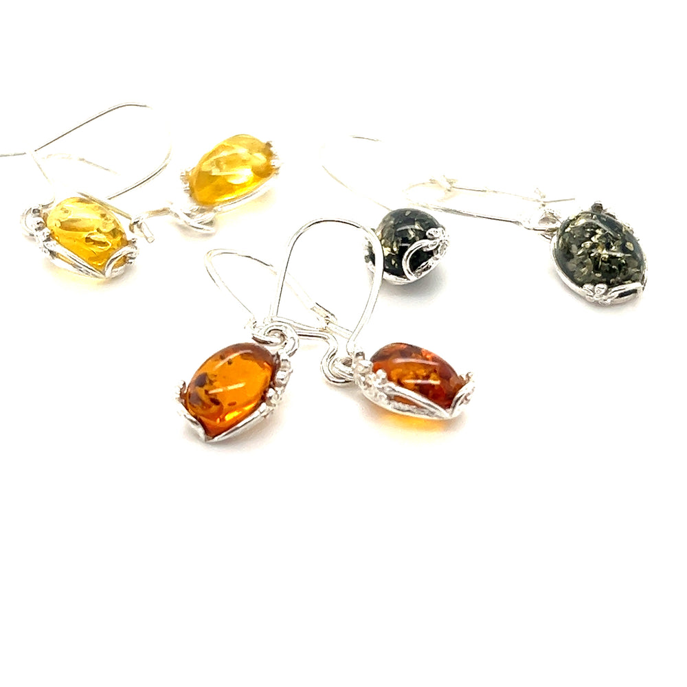 Super Silver's Tiny Glowing Oval Amber Earrings that showcase the natural elegance of amber with dangling design.
