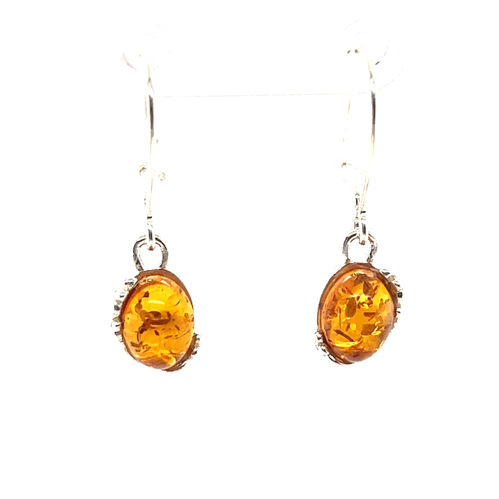 
                  
                    These Tiny Glowing Oval Amber Earrings from Super Silver exude natural elegance with their sterling silver design.
                  
                