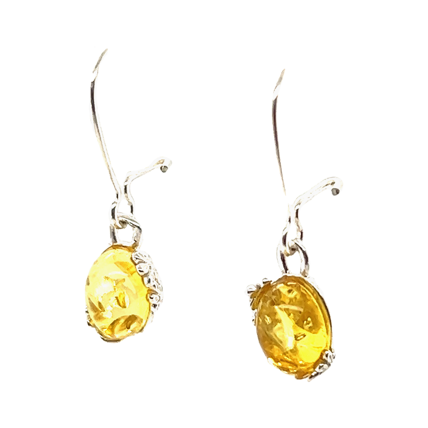 
                  
                    A pair of Tiny Glowing Oval Amber Earrings crafted in sterling silver, exuding natural elegance with their mesmerizing yellow amber stones by Super Silver.
                  
                