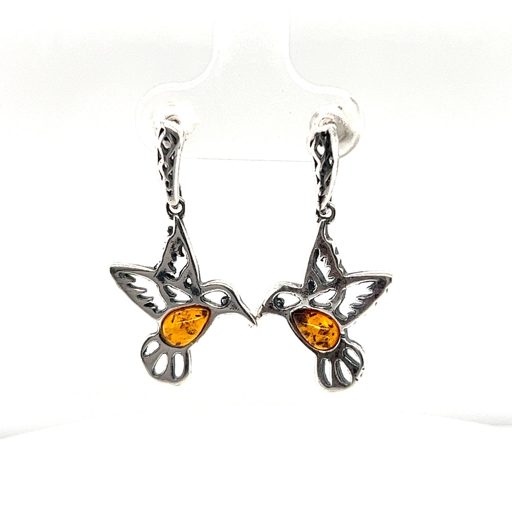 
                  
                    These Super Silver Amber Hummingbird Earrings are a unique addition to any jewelry collection. Handcrafted with care, these earrings showcase the timeless beauty of amber and the delicate charm of hummingbirds. Perfect for nature lovers.
                  
                