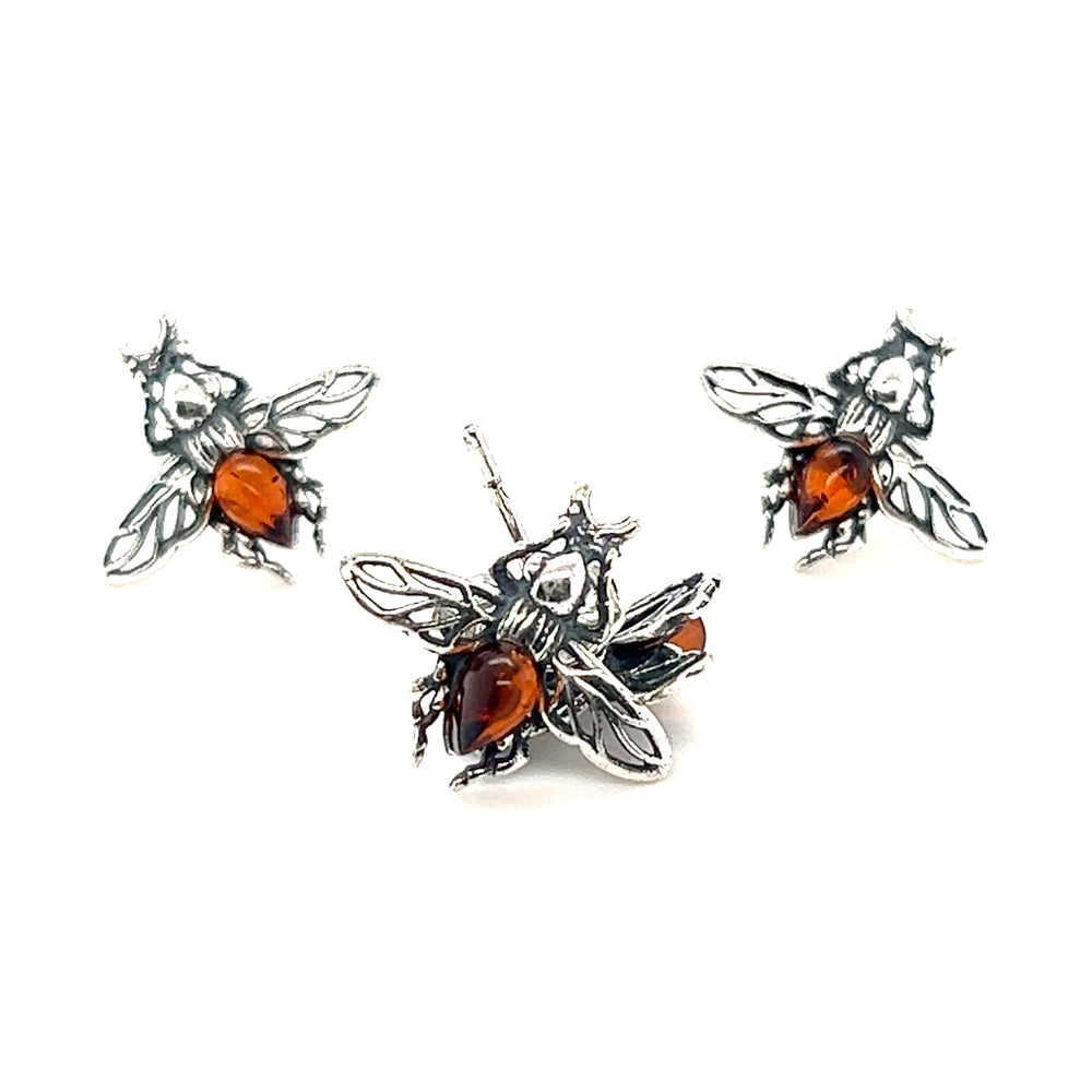 A pair of Detailed Baltic Amber Bee Studs adorned with stunning Baltic amber stones by Super Silver.
