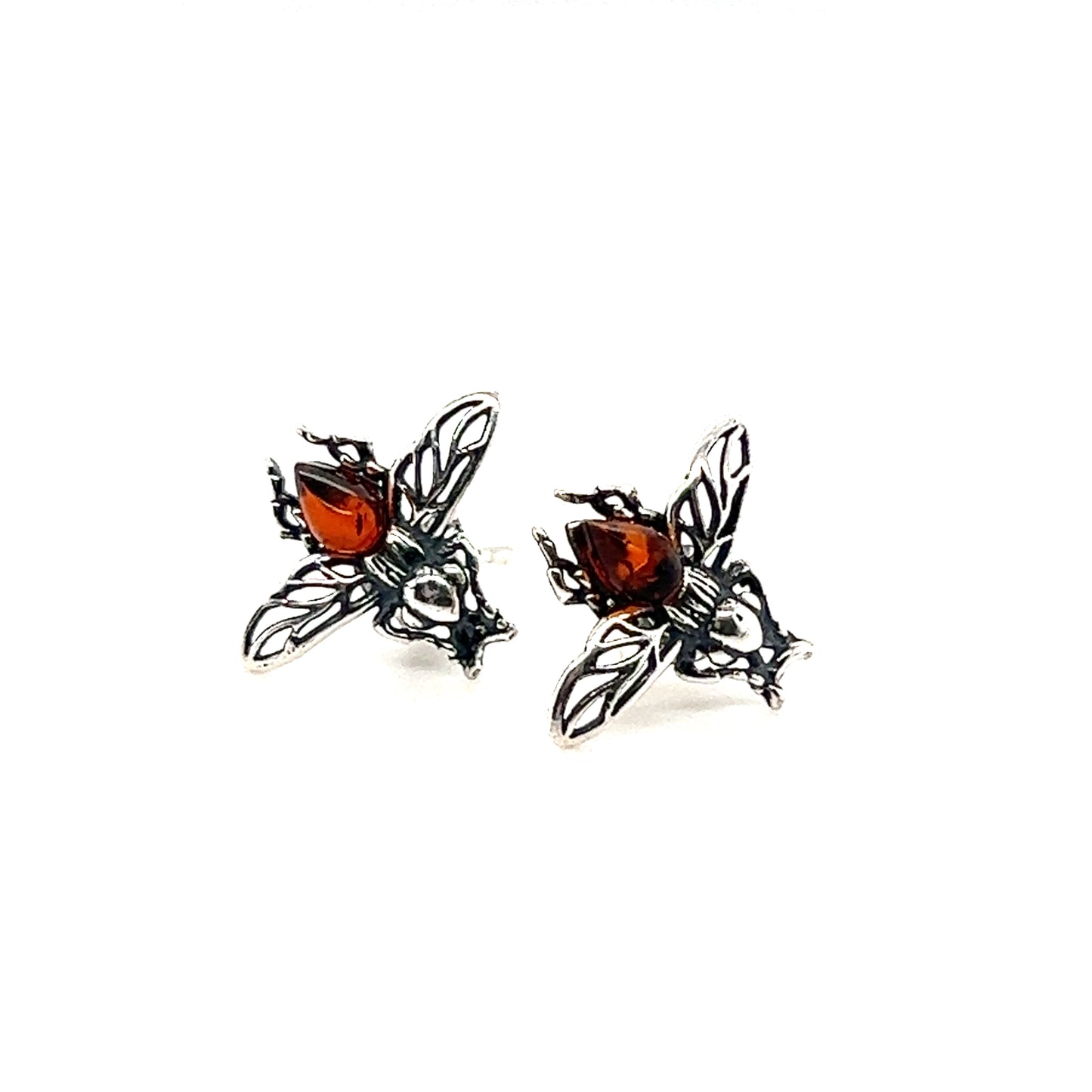 A pair of Detailed Baltic Amber Bee Studs made by Super Silver on a white background.