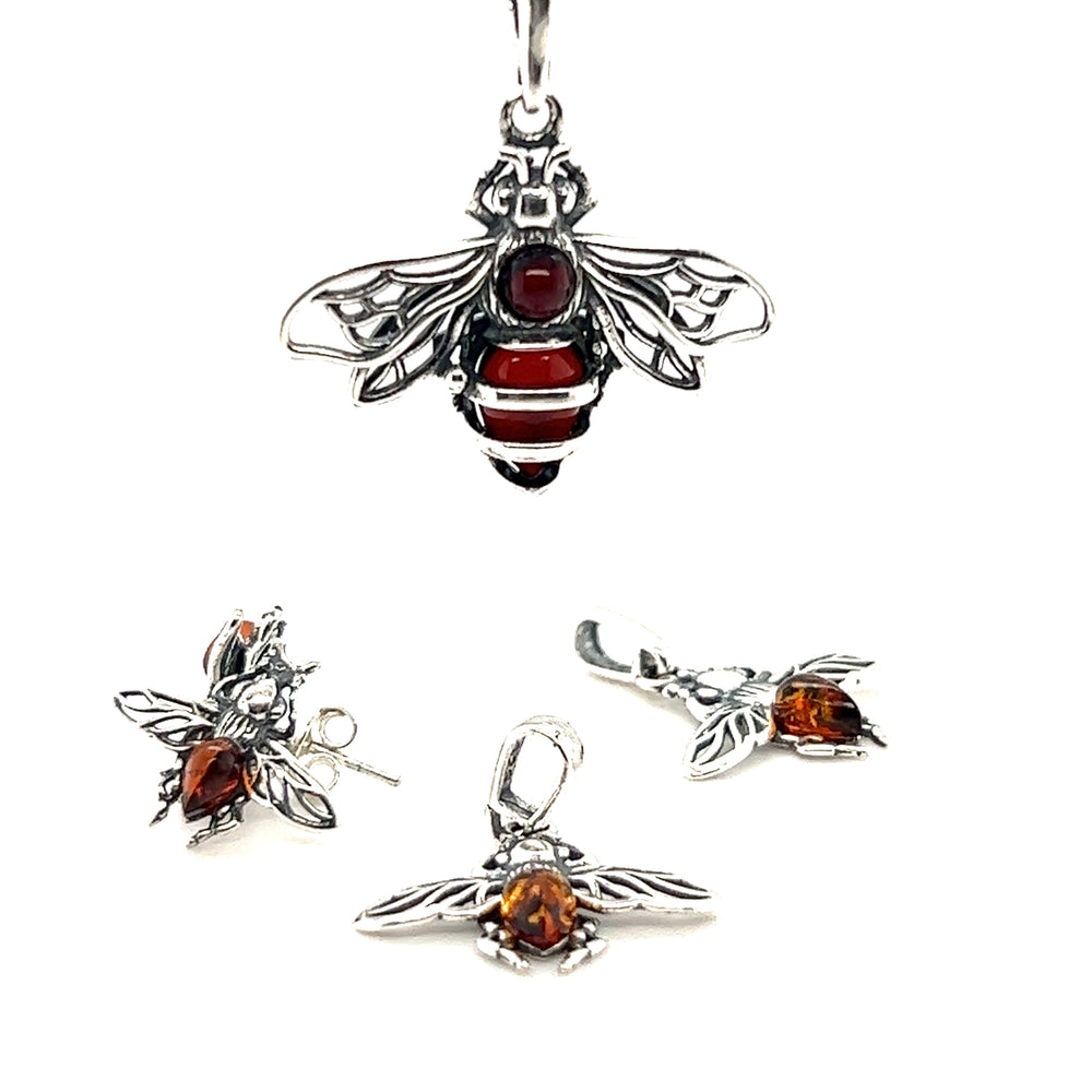 
                  
                    A Charming Amber Bee Pendant necklace and earrings adorned with vibrant red stones, carefully crafted in .925 sterling silver from Super Silver.
                  
                