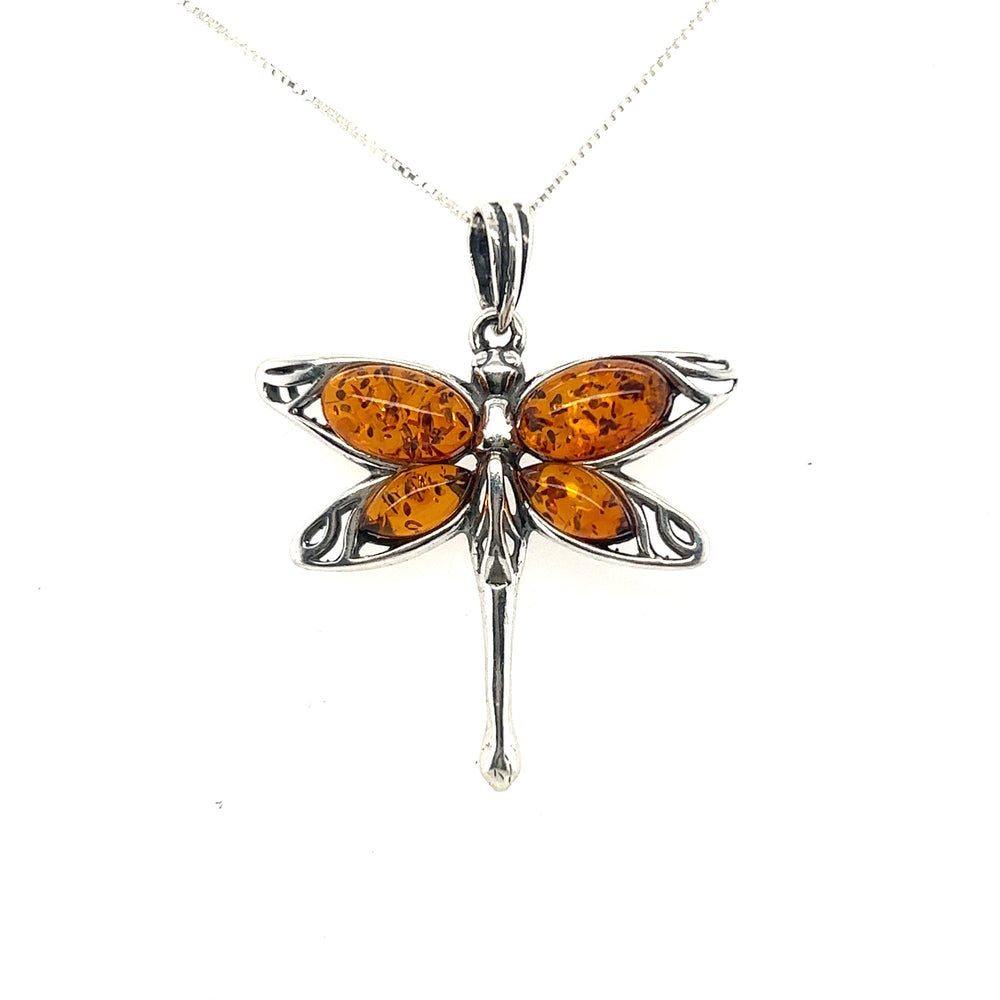
                  
                    Super Silver Baltic Amber Dragonfly Pendant made from a powerful healing stone.
                  
                