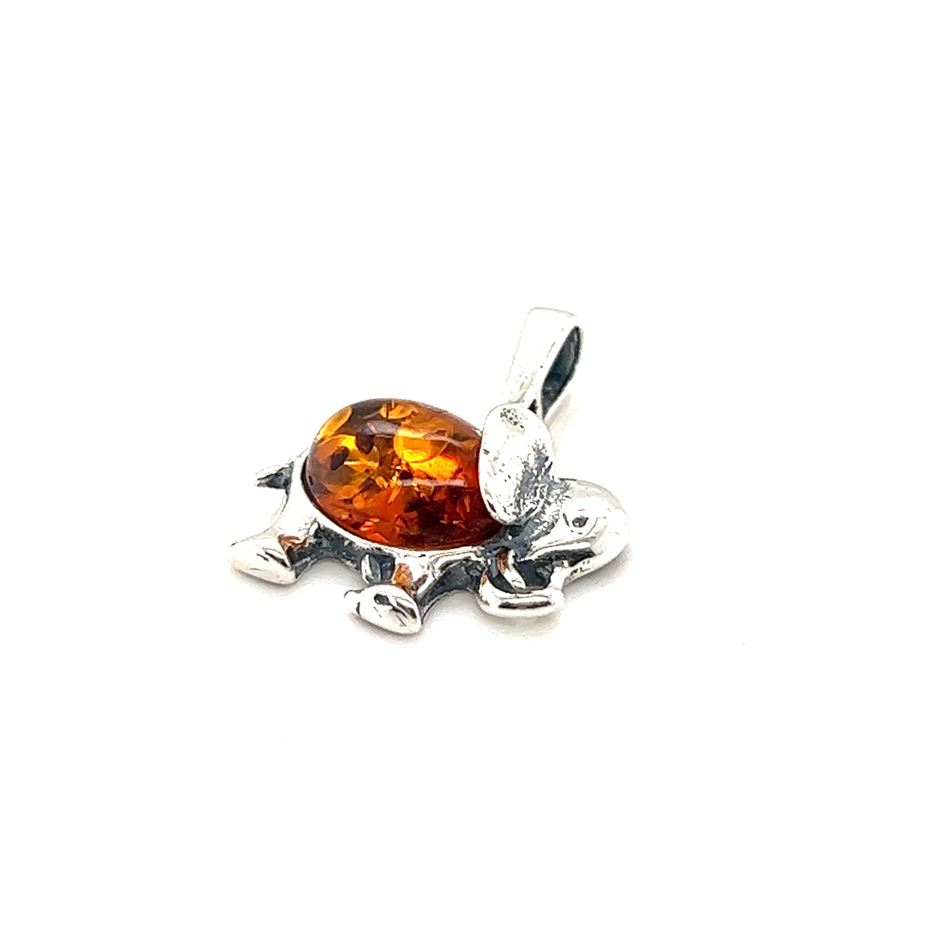 A Dainty Amber Elephant Pendant from Super Silver, made with sterling silver and featuring a Baltic amber stone and elephant pendant.