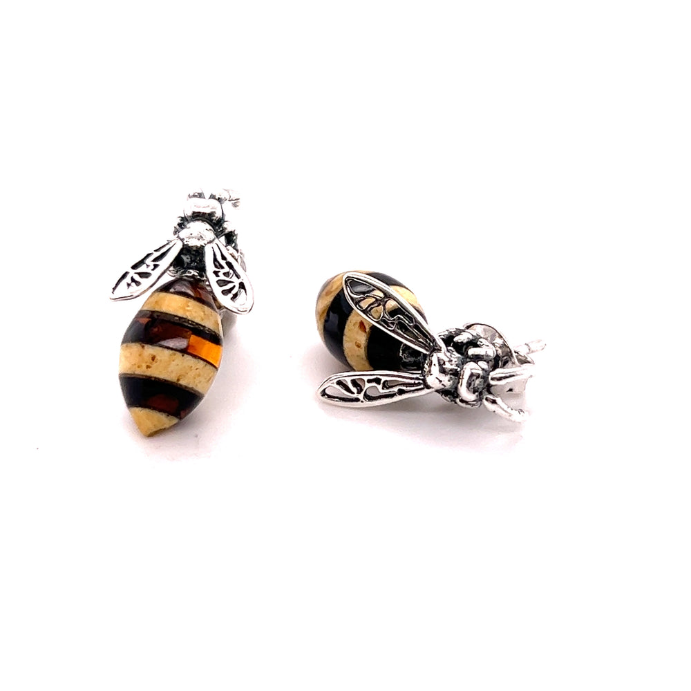 
                  
                    Super Silver Amber Yellow Jacket Stud Earrings with a bee design and filigree wings.
                  
                