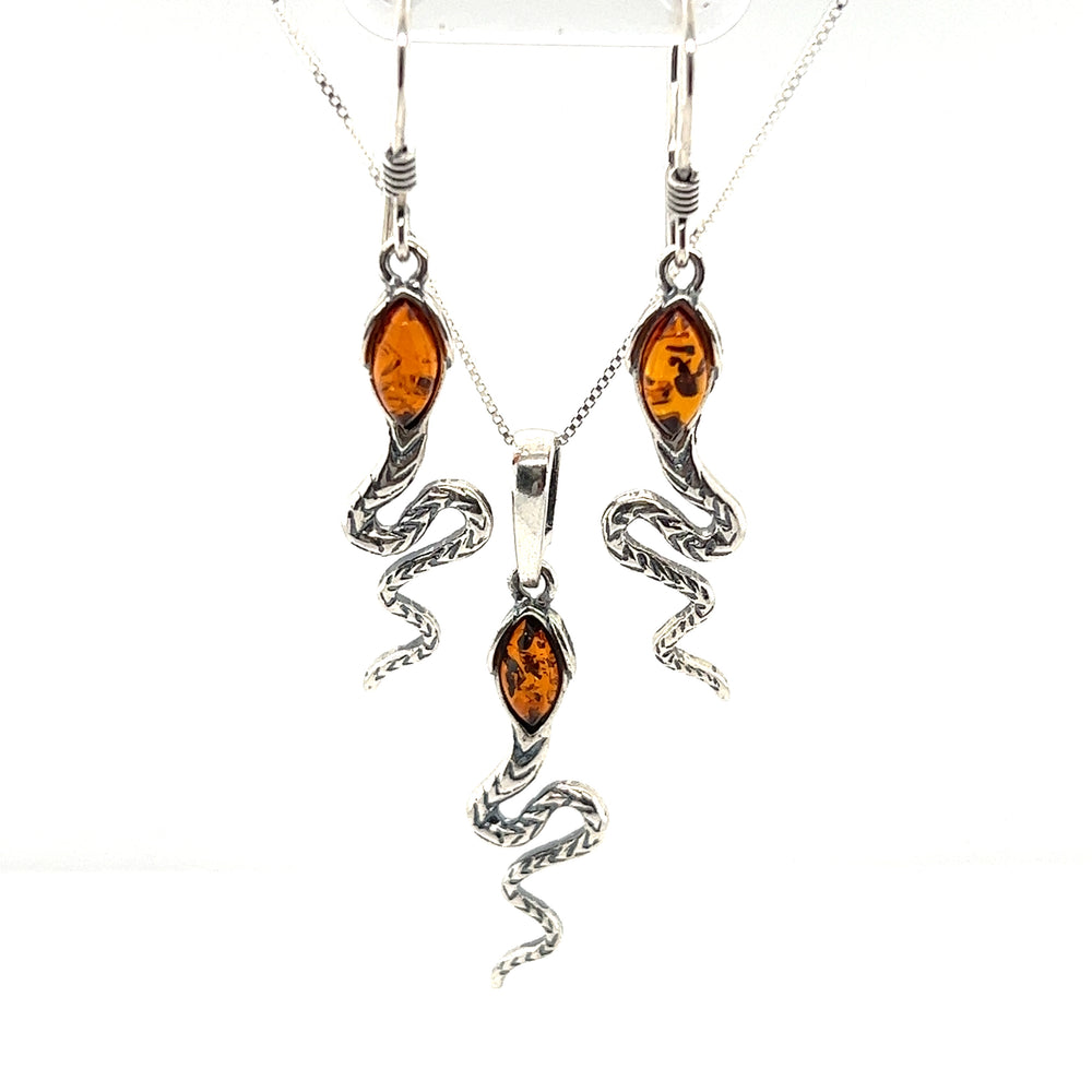 
                  
                    Alluring Amber Snake Pendant necklace and earrings set featuring .925 Sterling Silver accents, by Super Silver.
                  
                