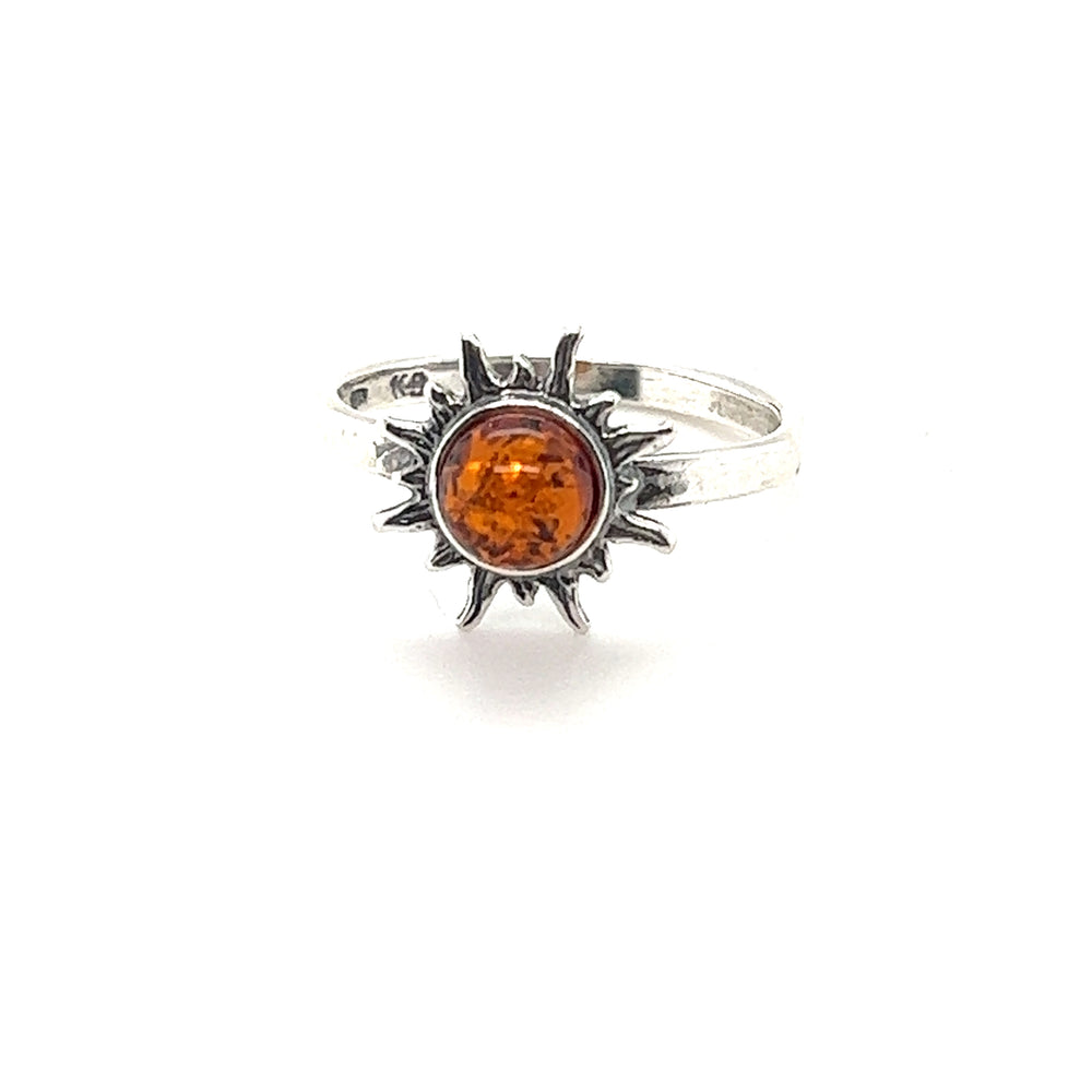 A Brilliant Dainty Amber Sun Ring that exudes classic glamour with its sterling silver band. The earthy boho vibes of this exquisite piece are accentuated by the radiant sun-shaped amber stone at