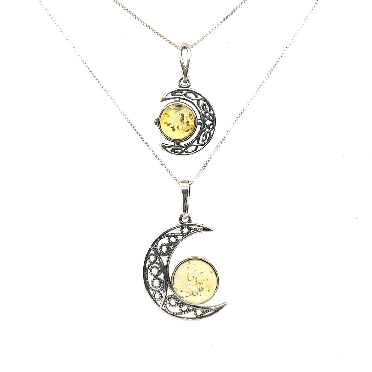 
                  
                    An Stunning Filigree Amber Moon Pendant with a moon from Super Silver.
                  
                