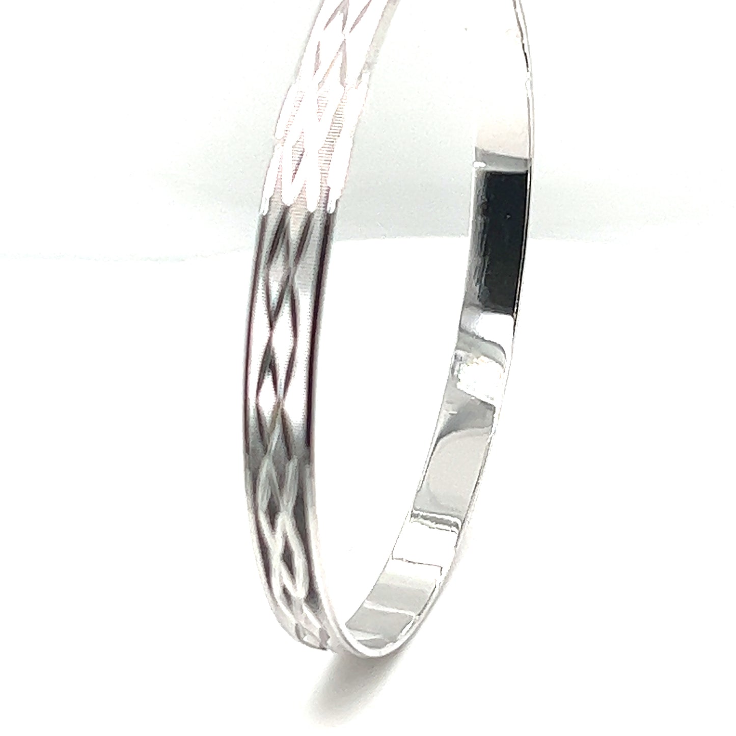 
                  
                    A Super Silver Brilliant Diamond Etched Bangle with an intricate design.
                  
                