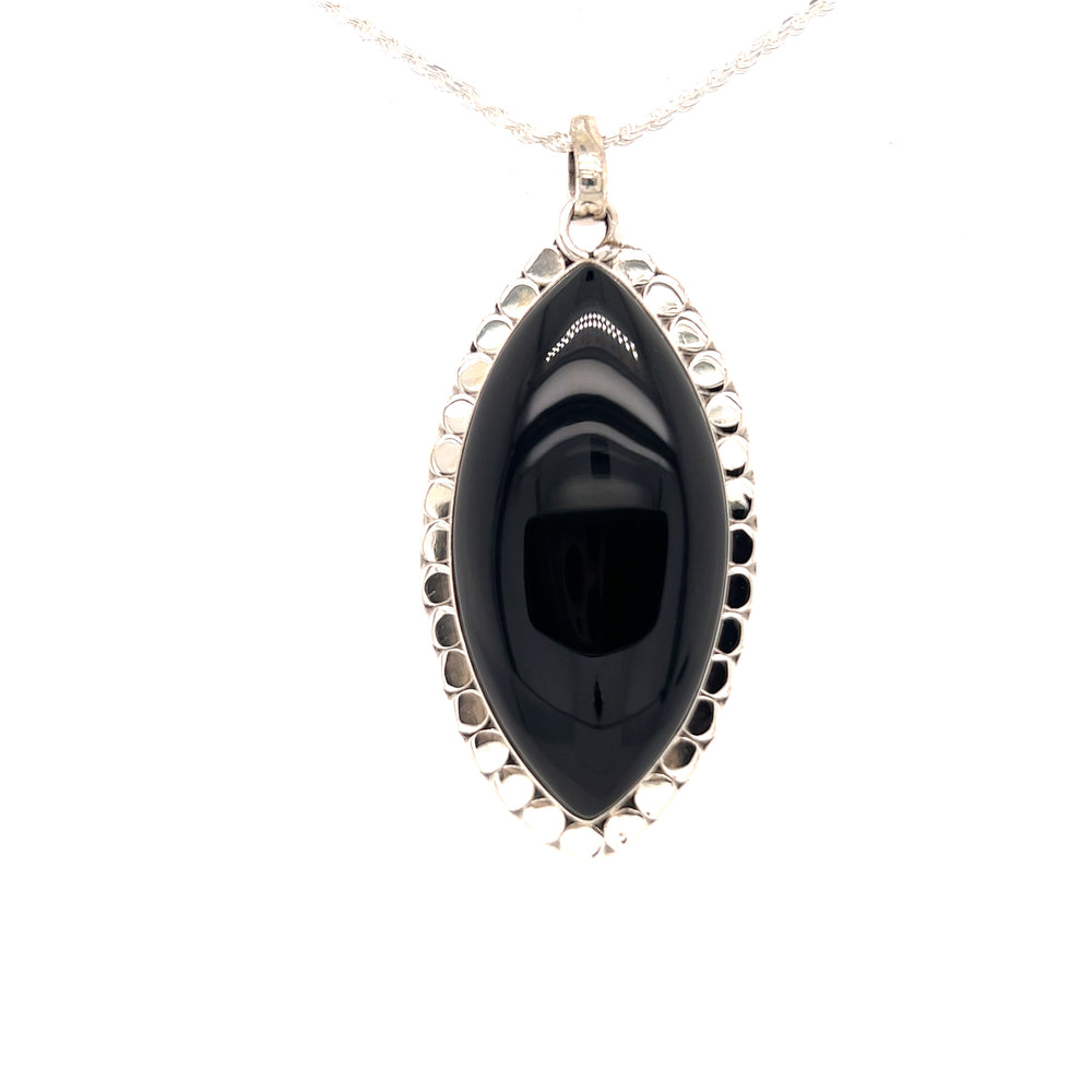 A powerful Statement Onyx Pendant with a Textured Setting on a silver chain by Super Silver.