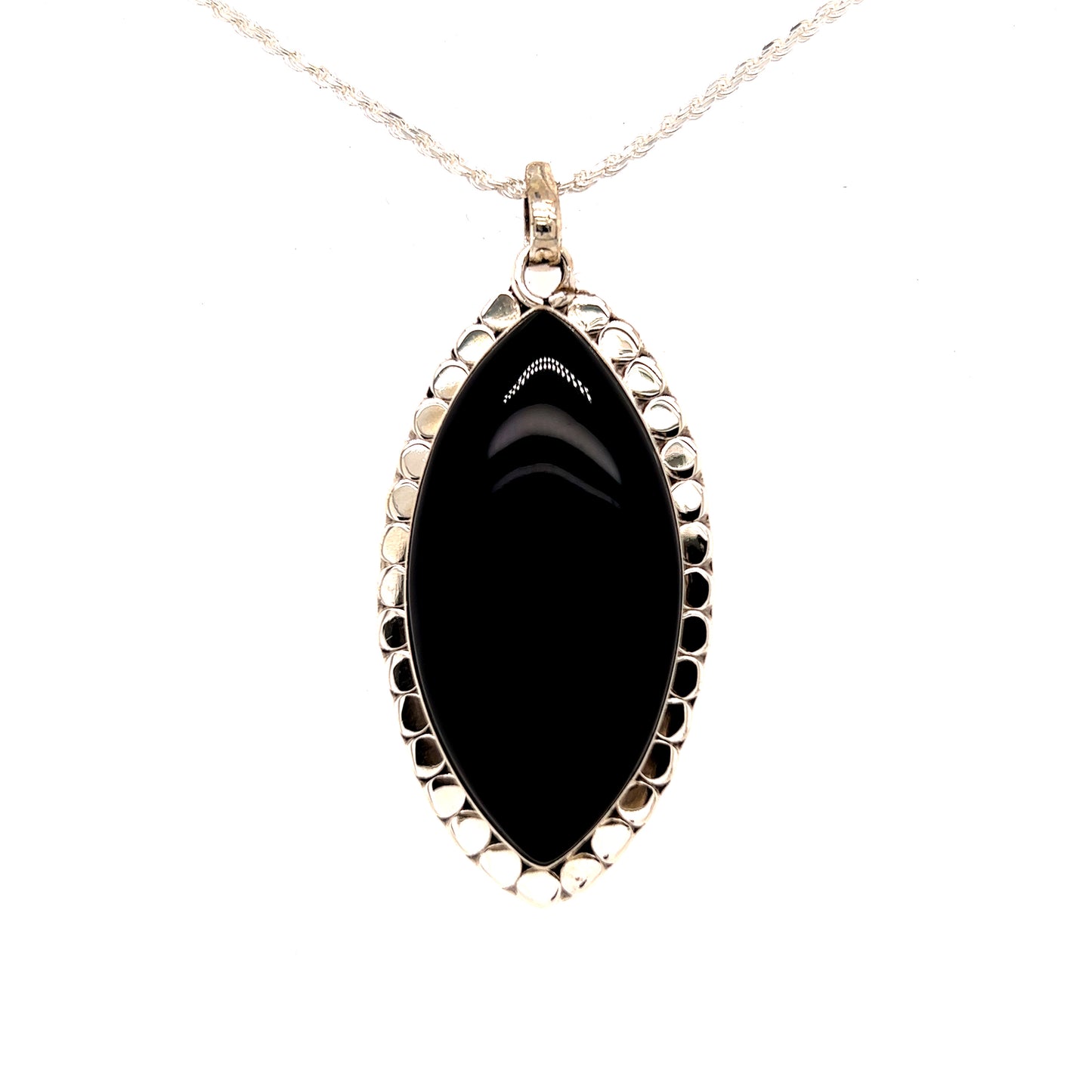 A powerful Statement Onyx Pendant with a Textured Setting on a gold chain from Super Silver.