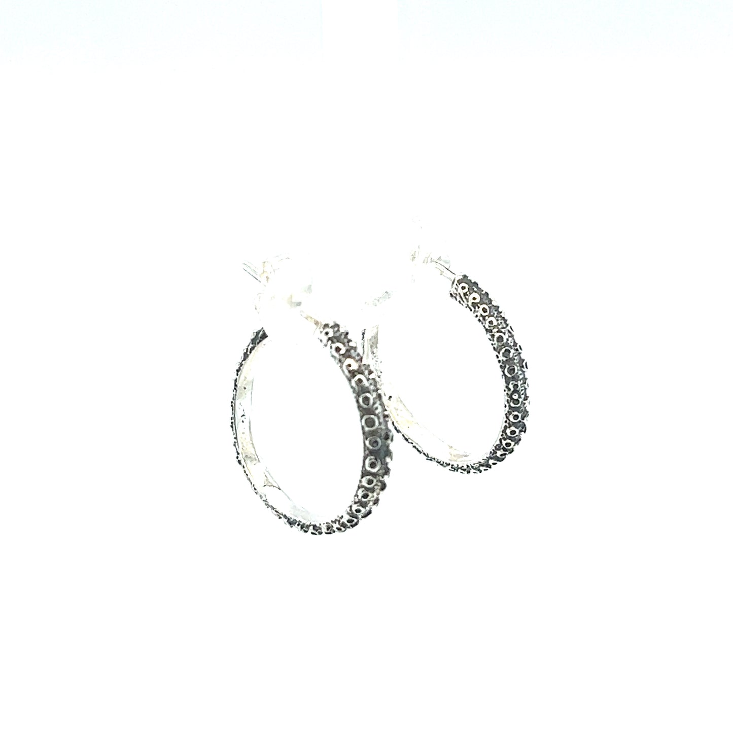 
                  
                    A pair of Handcrafted Octopus Tentacle Hoops by Super Silver with black diamonds and an oxidized finish.
                  
                
