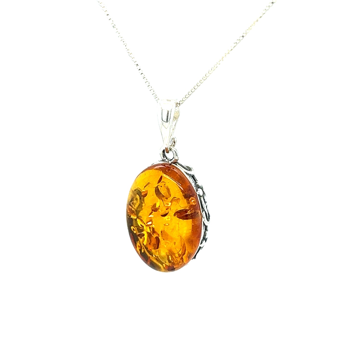 
                  
                    Vintage-styled Super Silver Cognac Amber Oval Pendant with Floral Border in sterling silver.
                  
                