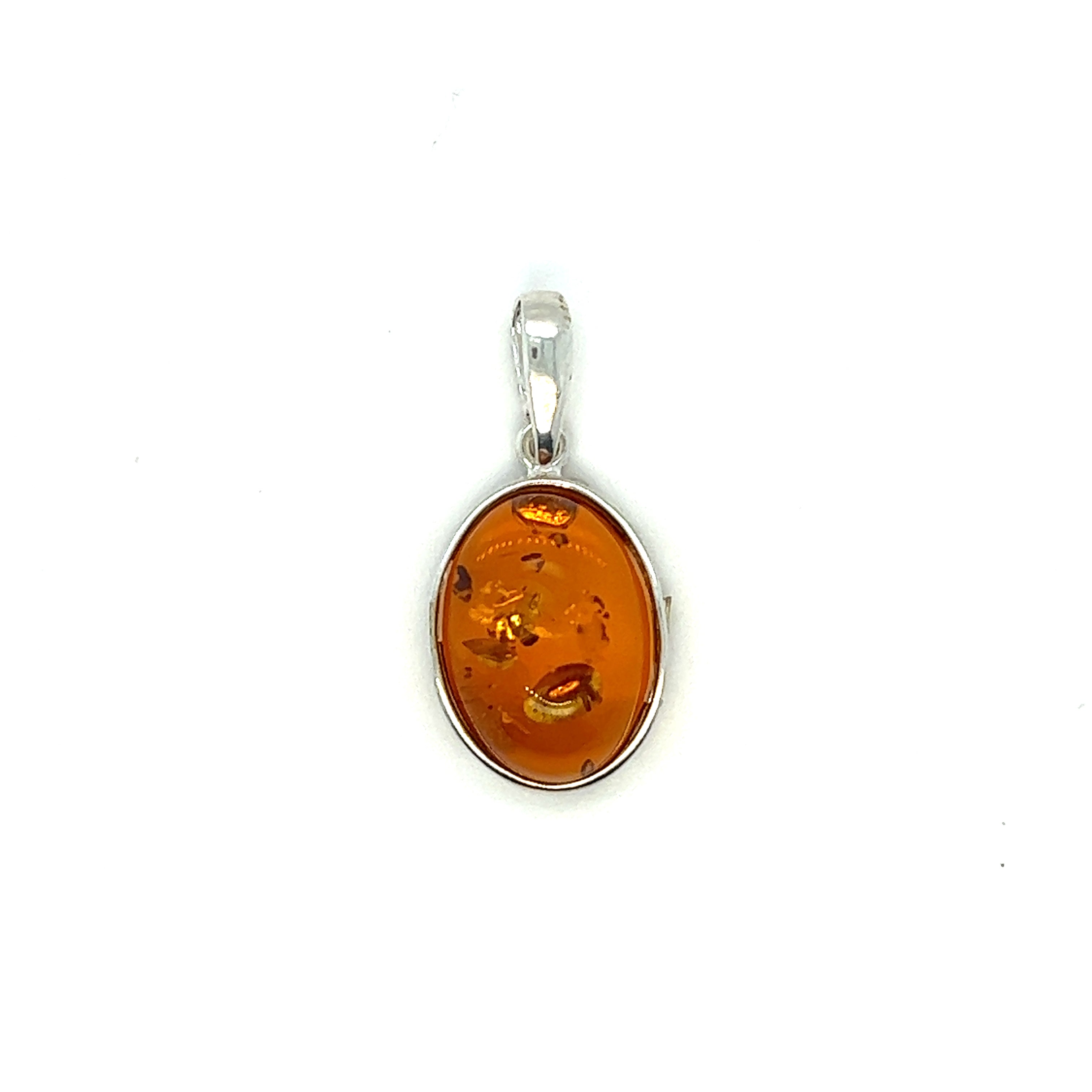 A Timeless Oval Amber Pendant from Super Silver on a white background, known for its healing properties.