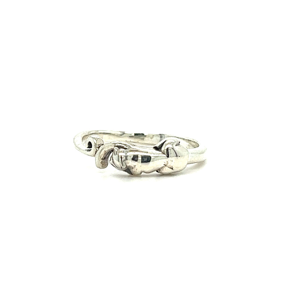 A minimalist Delicate Wrapped Cat Ring with a heart on it.