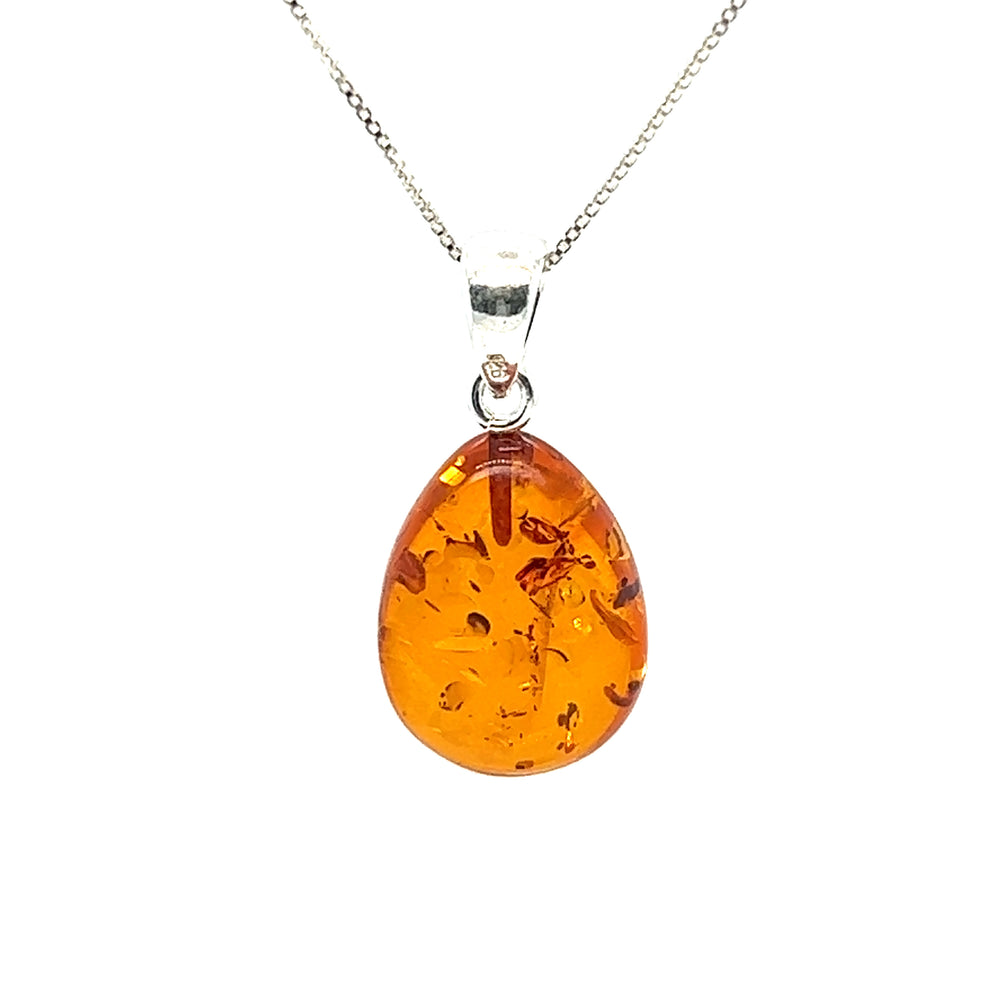 
                  
                    A Super Silver Teardrop Amber Pendant necklace exuding healing energy, perfect for boho minimalism.
                  
                