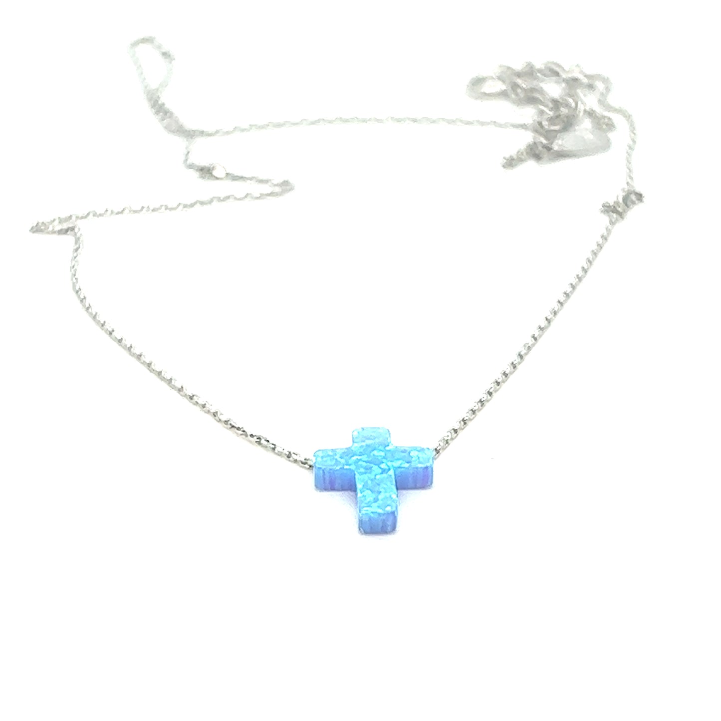 
                  
                    A delicate Blue Opal Cross Necklace on a silver chain from Super Silver.
                  
                