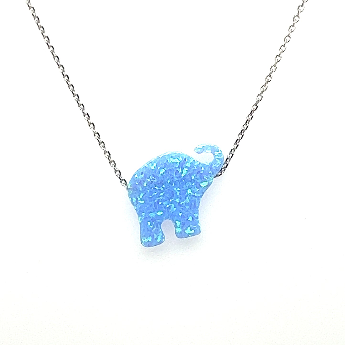 
                  
                    A Super Silver Blue Opal Elephant Necklace with a boho vibe on a chain.
                  
                