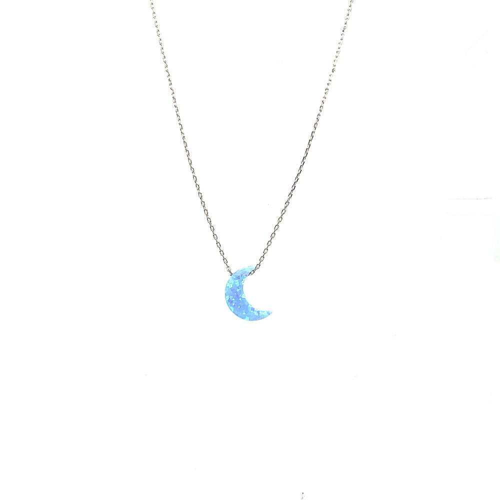 
                  
                    A Super Silver Blue Opal Moon Necklace adorned with a blue moon.
                  
                