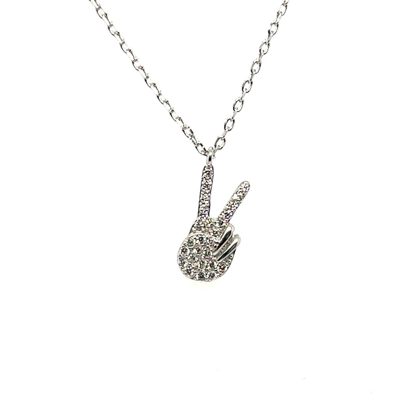
                  
                    A Glitzy Peace Sign Necklace with a diamond peace sign on it by Super Silver.
                  
                
