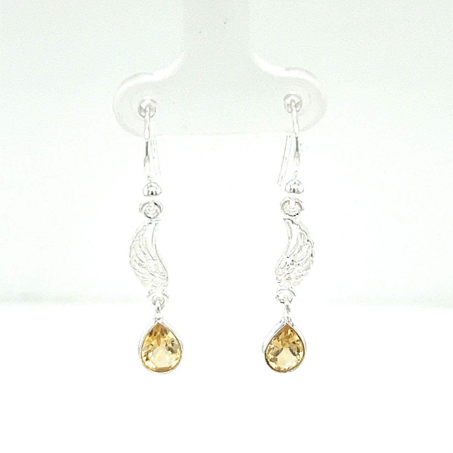 
                  
                    A pair of Super Silver angel wing earrings with citrine stones.
                  
                