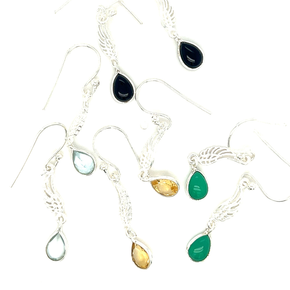 A set of Super Silver angel wing earrings adorned with vibrant green, blue, and yellow teardrop-shaped stones.