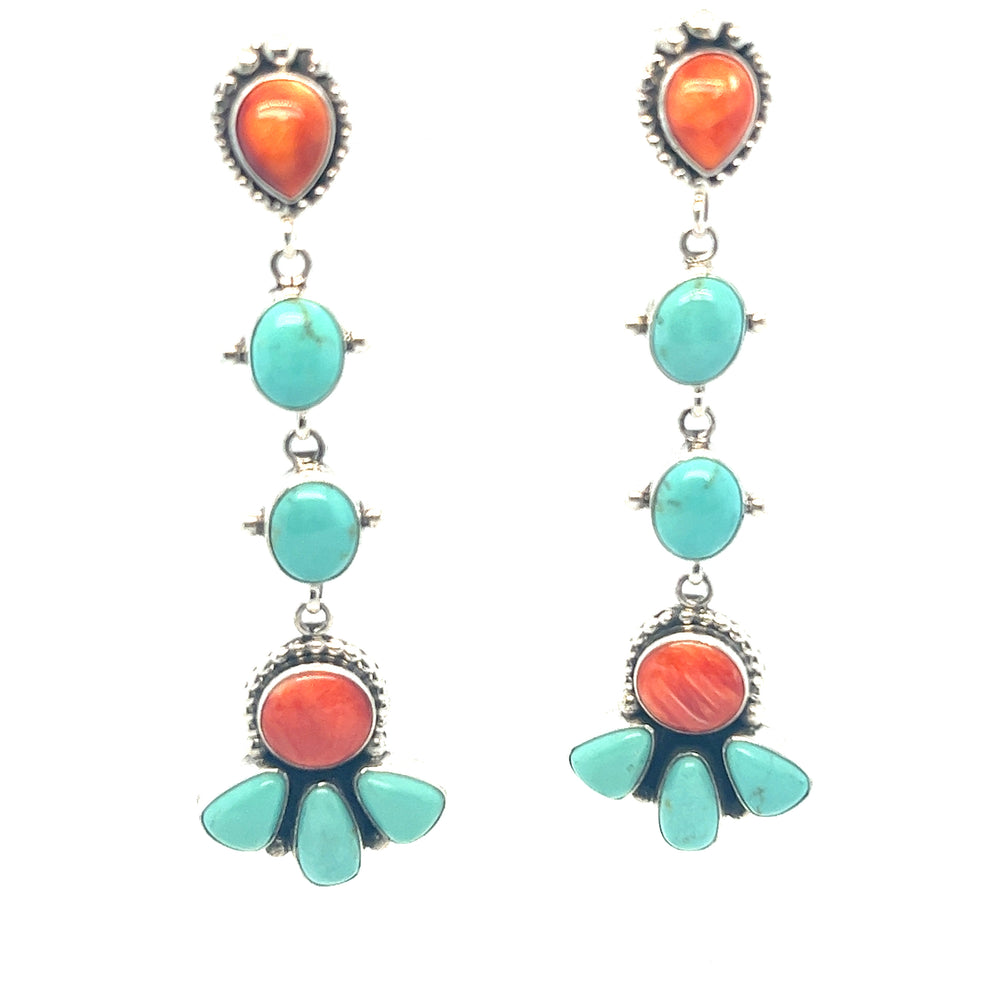 Super Silver's Handcrafted Statement Turquoise and Shell Earrings, adorned with turquoise stones.