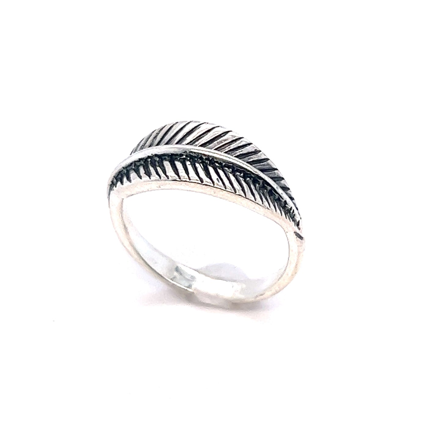 A Super Silver Oxidized Feather Ring with a southwestern design.