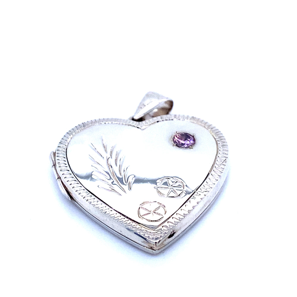 
                  
                    A romantic Heart Shaped Locket with Stone and lacy Etching encrusted with purple stones by Super Silver.
                  
                