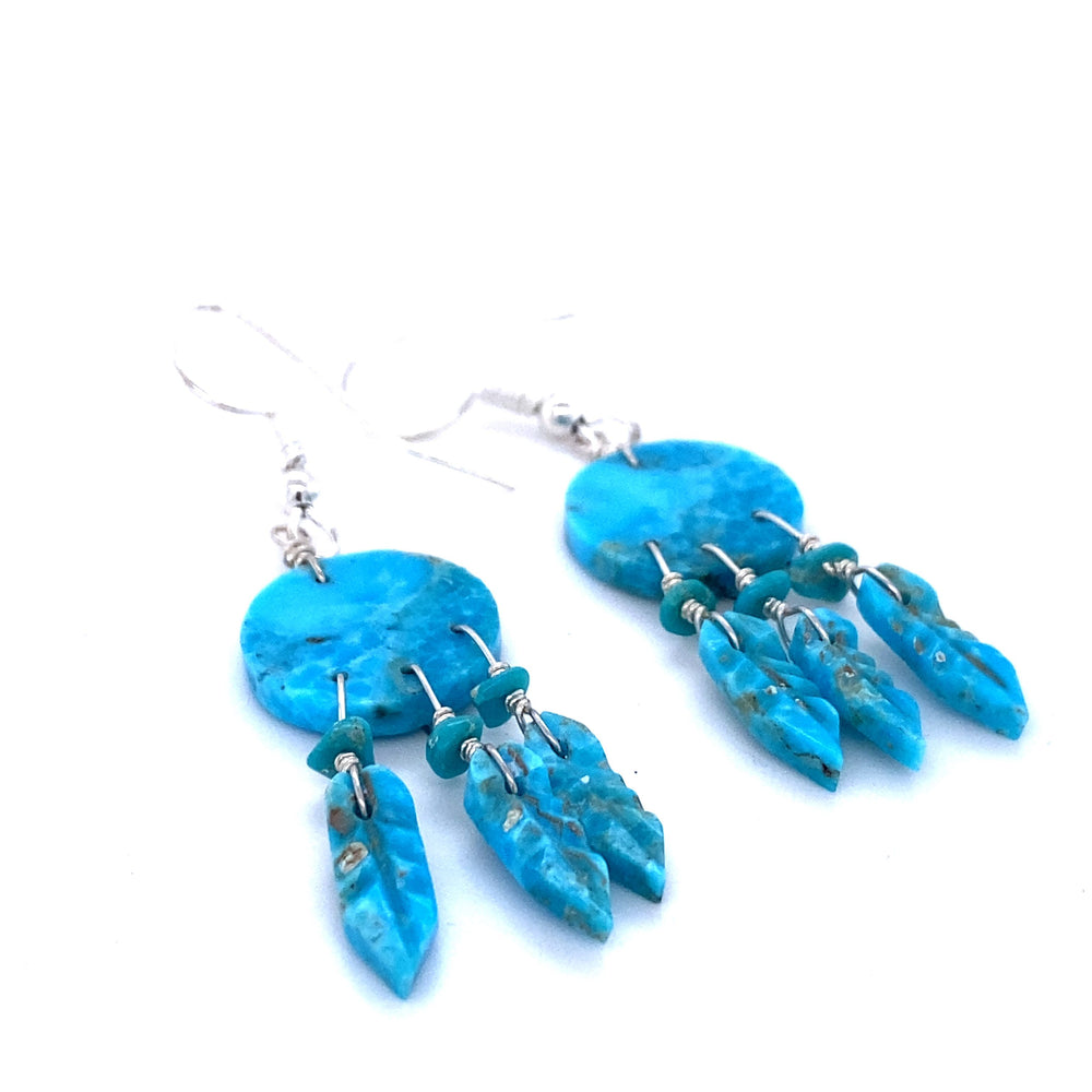 Handcrafted Super Silver Native American turquoise earrings with silver dangles.
