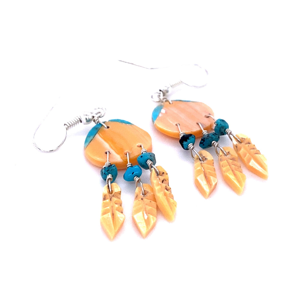 
                  
                    A pair of Handmade Earrings with 3 Small Stone Feathers, inspired by Native American culture and crafted by skilled Super Silver artisans with vibrant orange and blue beads.
                  
                
