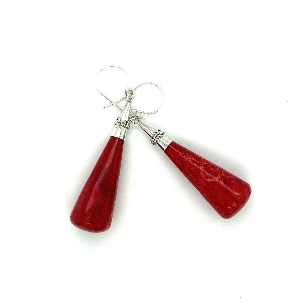 
                  
                    A pair of long sponge coral drop earrings by Super Silver on a white background.
                  
                