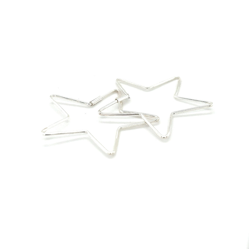 
                  
                    Two Super Silver Delicate Star Shaped Hoops on a white background.
                  
                
