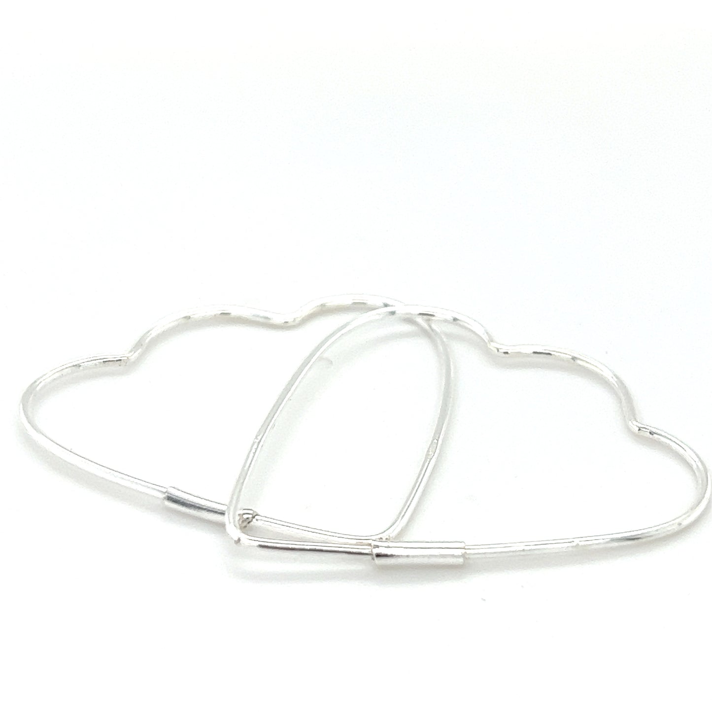 
                  
                    A pair of Delicate Heart Shaped Hoops by Super Silver.
                  
                