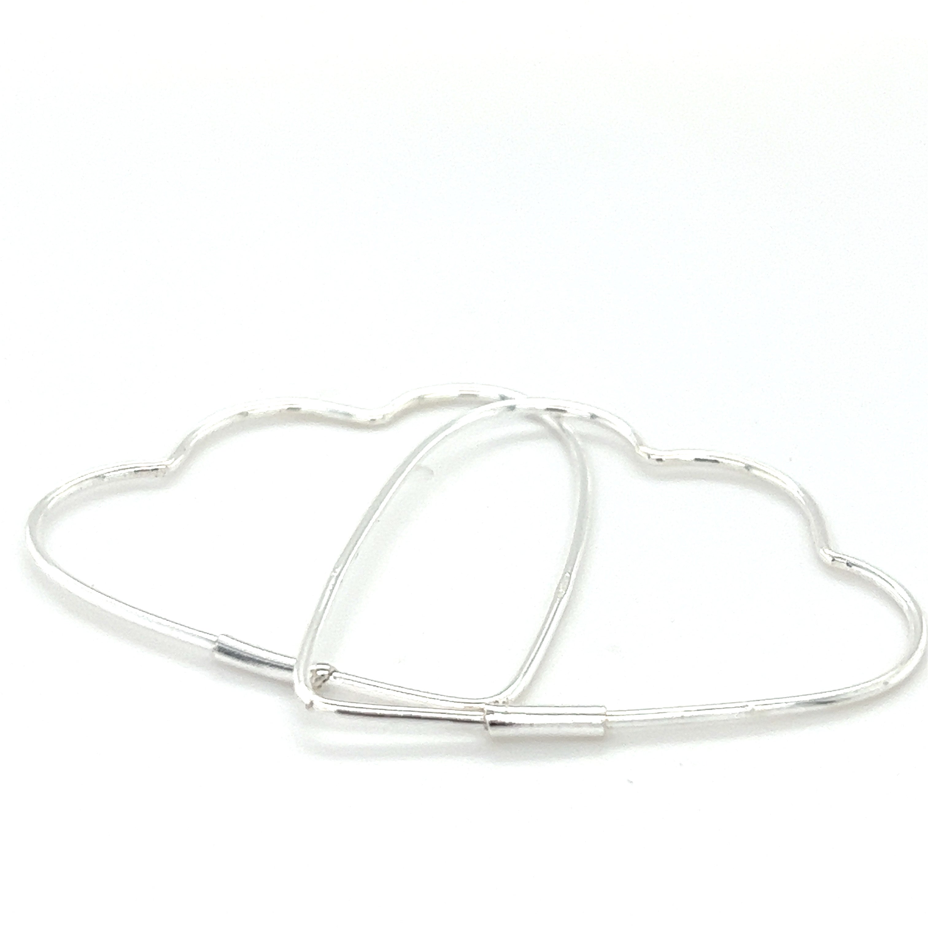 A pair of Delicate Heart Shaped Hoops by Super Silver.