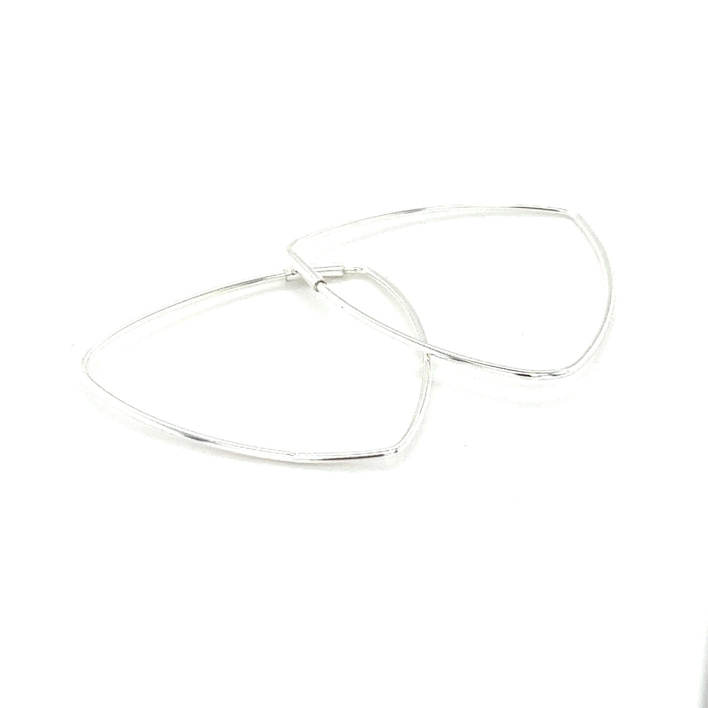 
                  
                    A pair of Delicate Triangle Shaped Hoops by Super Silver on a white surface.
                  
                