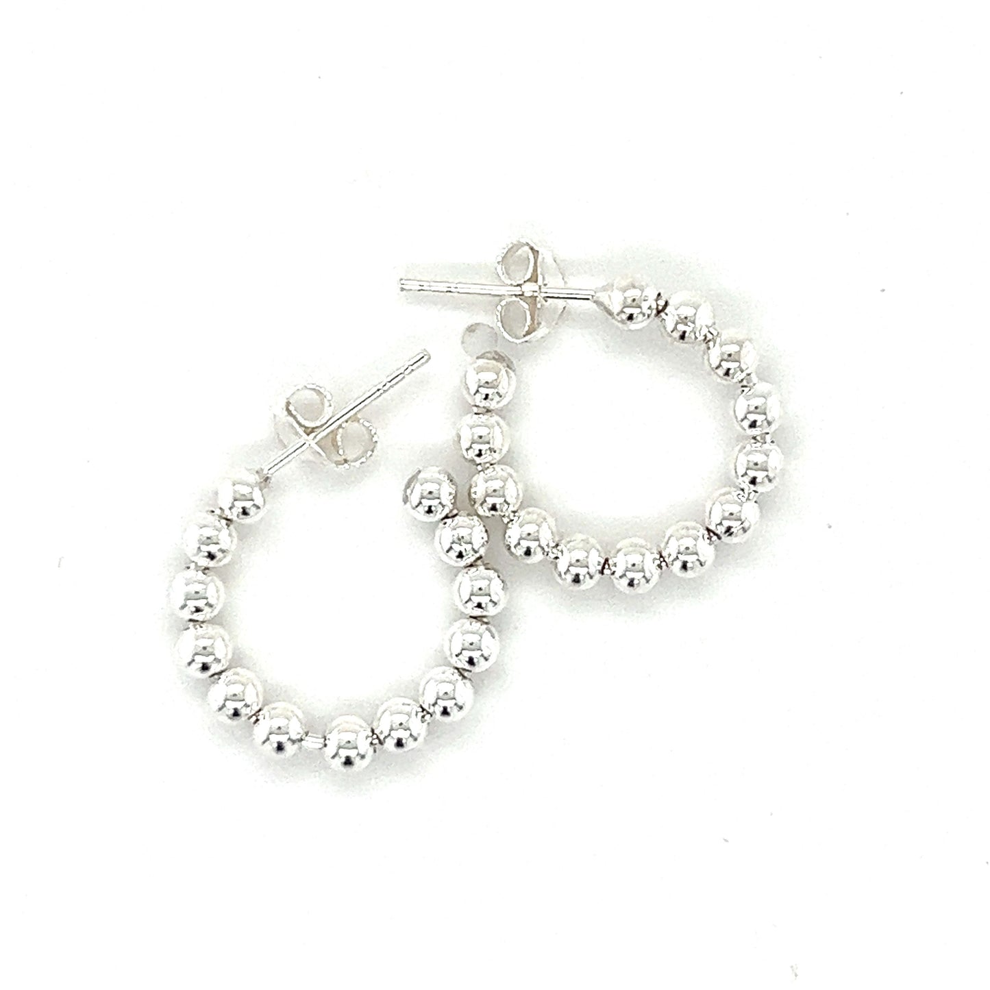 
                  
                    A pair of Delicate Ball Hoops With Post by Super Silver on a white background.
                  
                