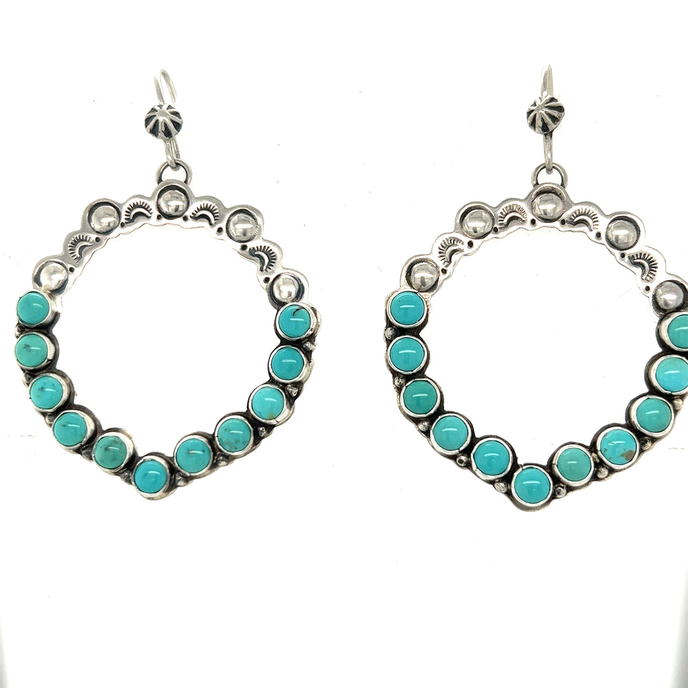 
                  
                    Super Silver's statement handmade turquoise earrings add southwestern elegance.
                  
                