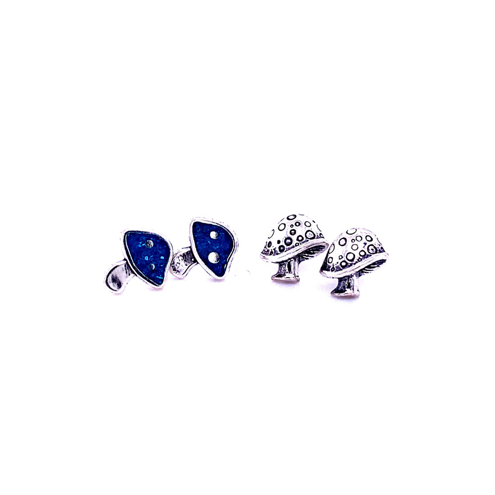 
                  
                    A pair of Mushroom Stud Earrings from Super Silver with blue stones.
                  
                