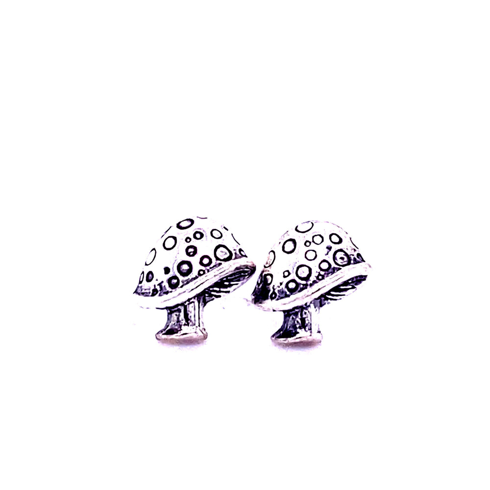 
                  
                    A pair of Super Silver mushroom stud earrings on a white background, crafted from .925 sterling silver.
                  
                
