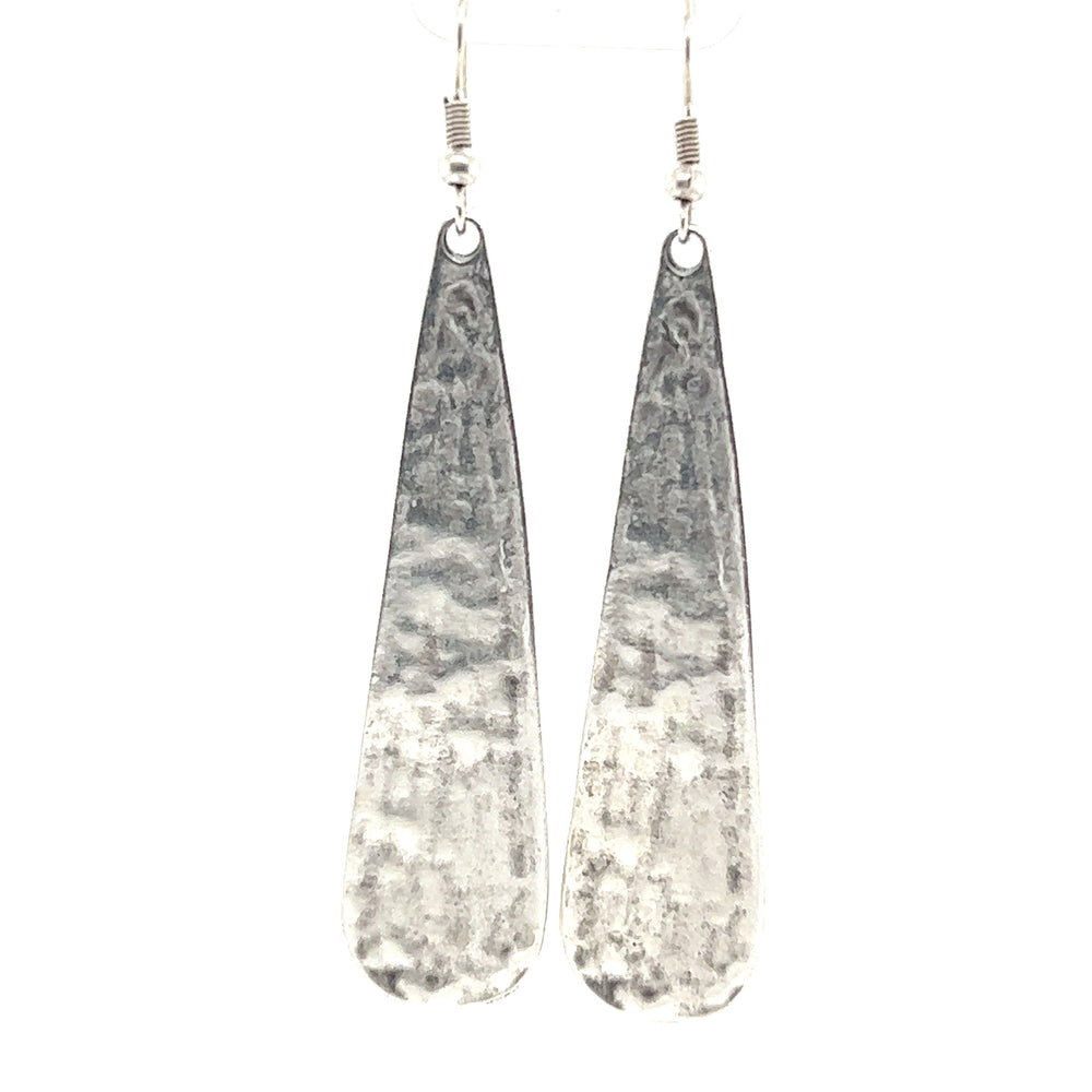 
                  
                    A pair of Super Silver Long Boho Statement Earrings on a white background.
                  
                