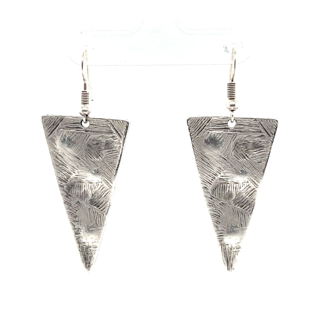 
                  
                    A pair of silver Super Silver triangular boho statement earrings, perfect for urban boho jewelry lovers. These boho-chic earrings stand out beautifully against a white background.
                  
                