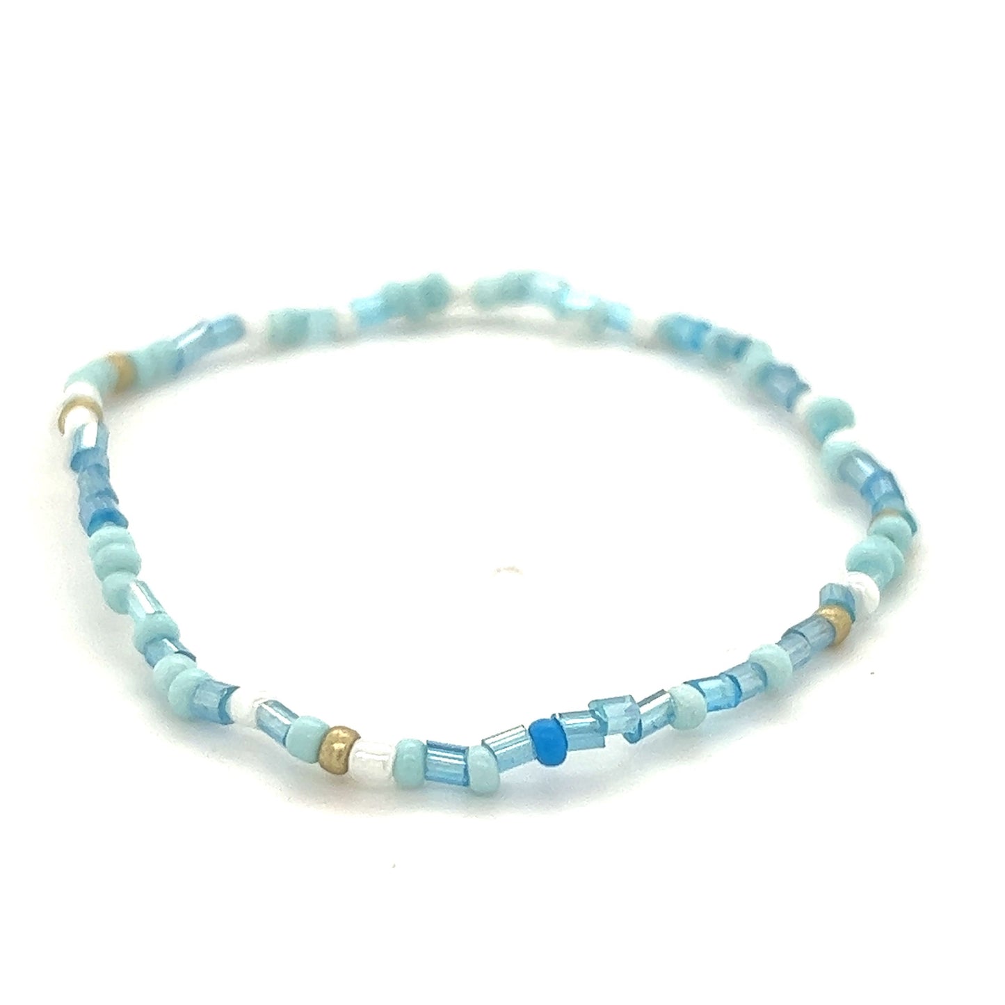 
                  
                    A Super Silver Dainty Beaded Bracelet with blue glass beads and a gold seed bead.
                  
                
