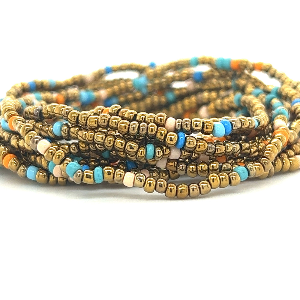 
                  
                    A stack of Super Silver Dainty Beaded Bracelets in vibrant gold and blue colors.
                  
                