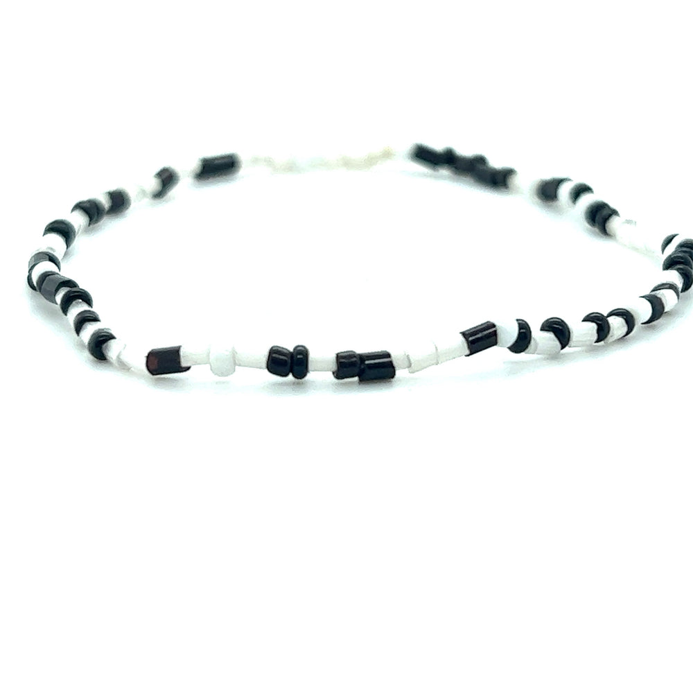 
                  
                    A Super Silver Dainty Beaded Bracelet against a white background.
                  
                