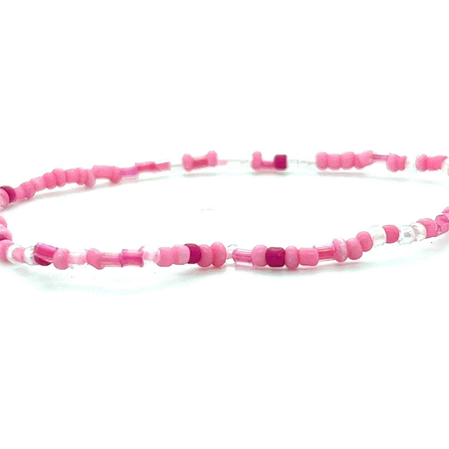
                  
                    A Dainty Beaded Bracelet by Super Silver featuring pink and white colors on a white background.
                  
                