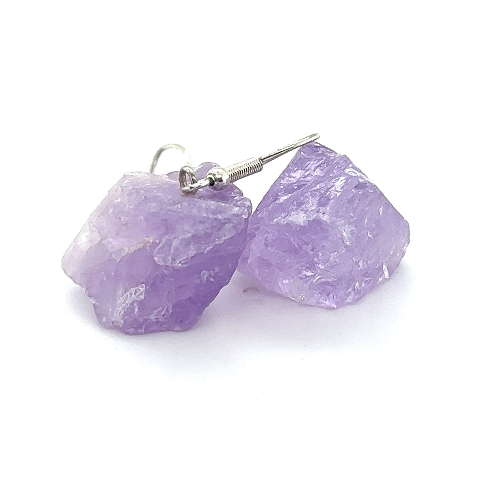 Raw Crystal earrings featuring stunning black tourmaline accents. This elegant pair of Super Silver earrings is a must-have for any amethyst lover.