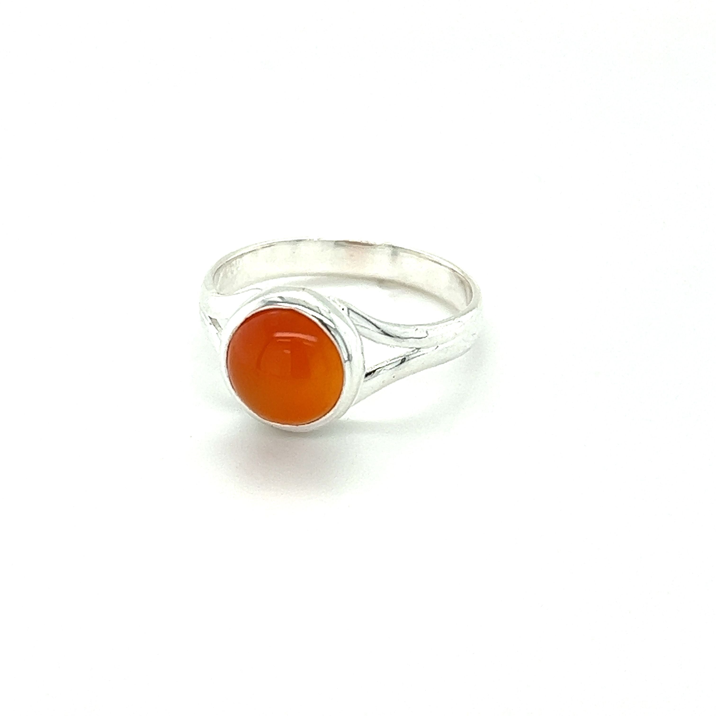 A Simple Vibrant Circular Stone Ring from Super Silver adorned with a natural orange stone.