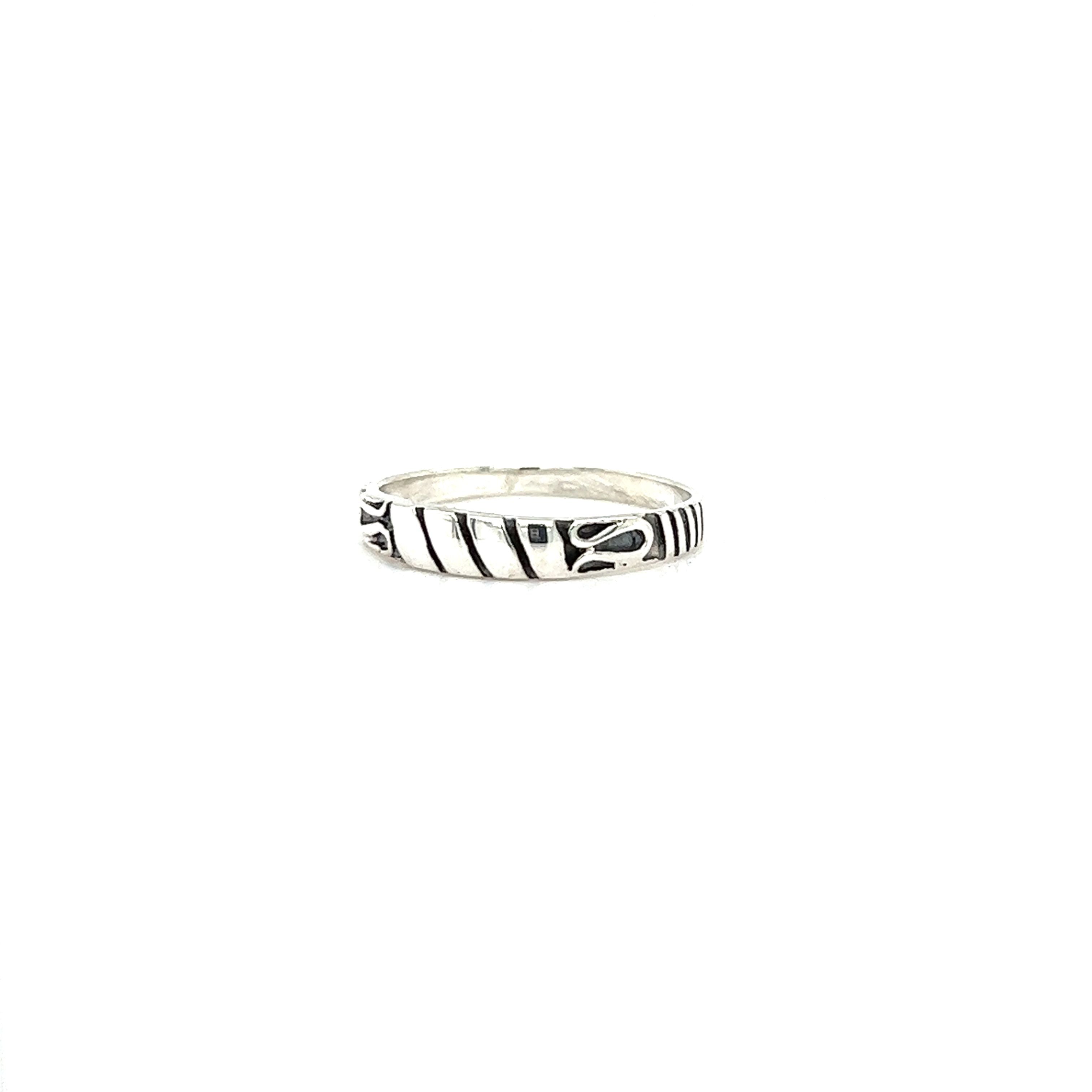 A Bali Style Silver Band ring with black and white stripes, perfect for those embracing a bohemian style.